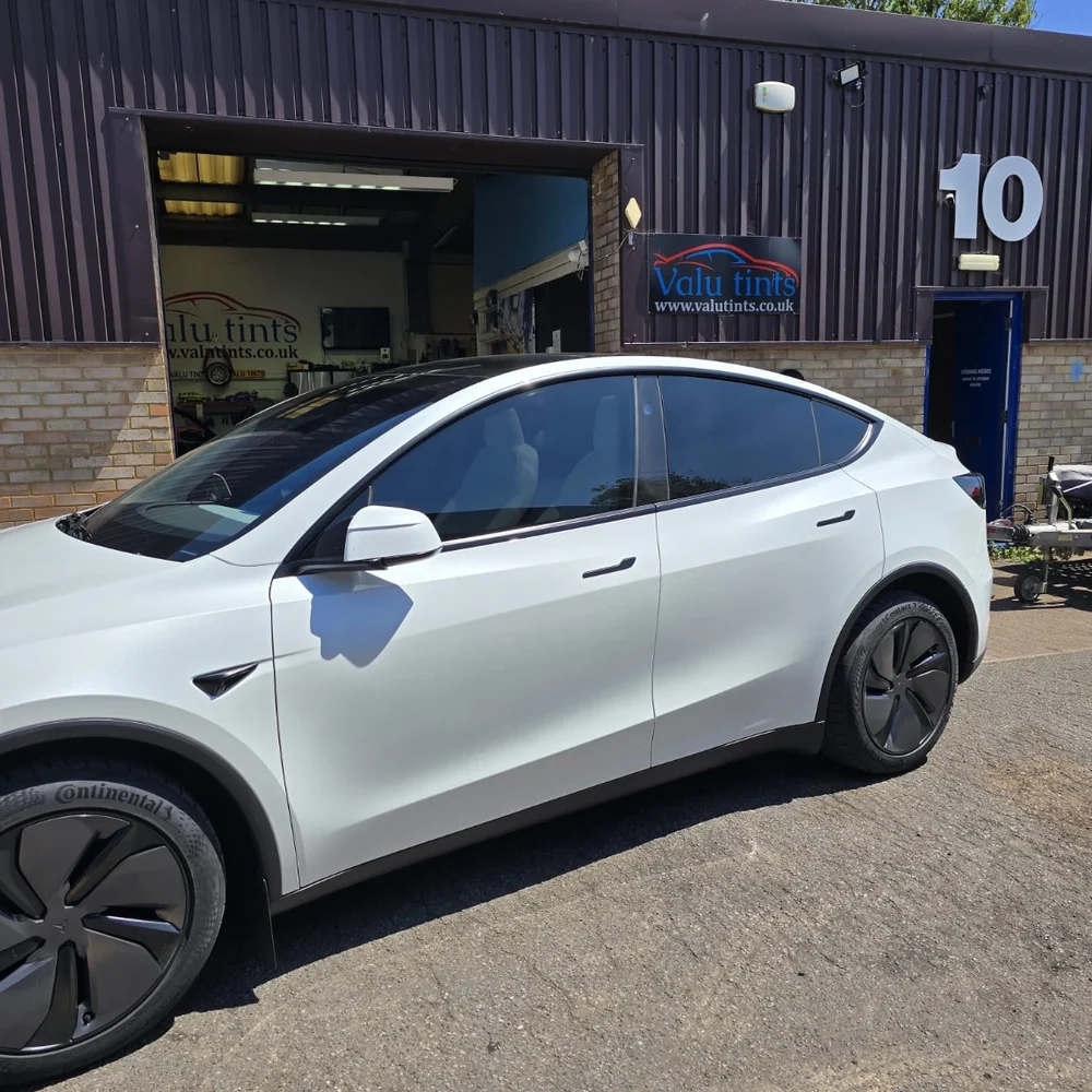 White Tesla with completed window tinting outside Valu Tints