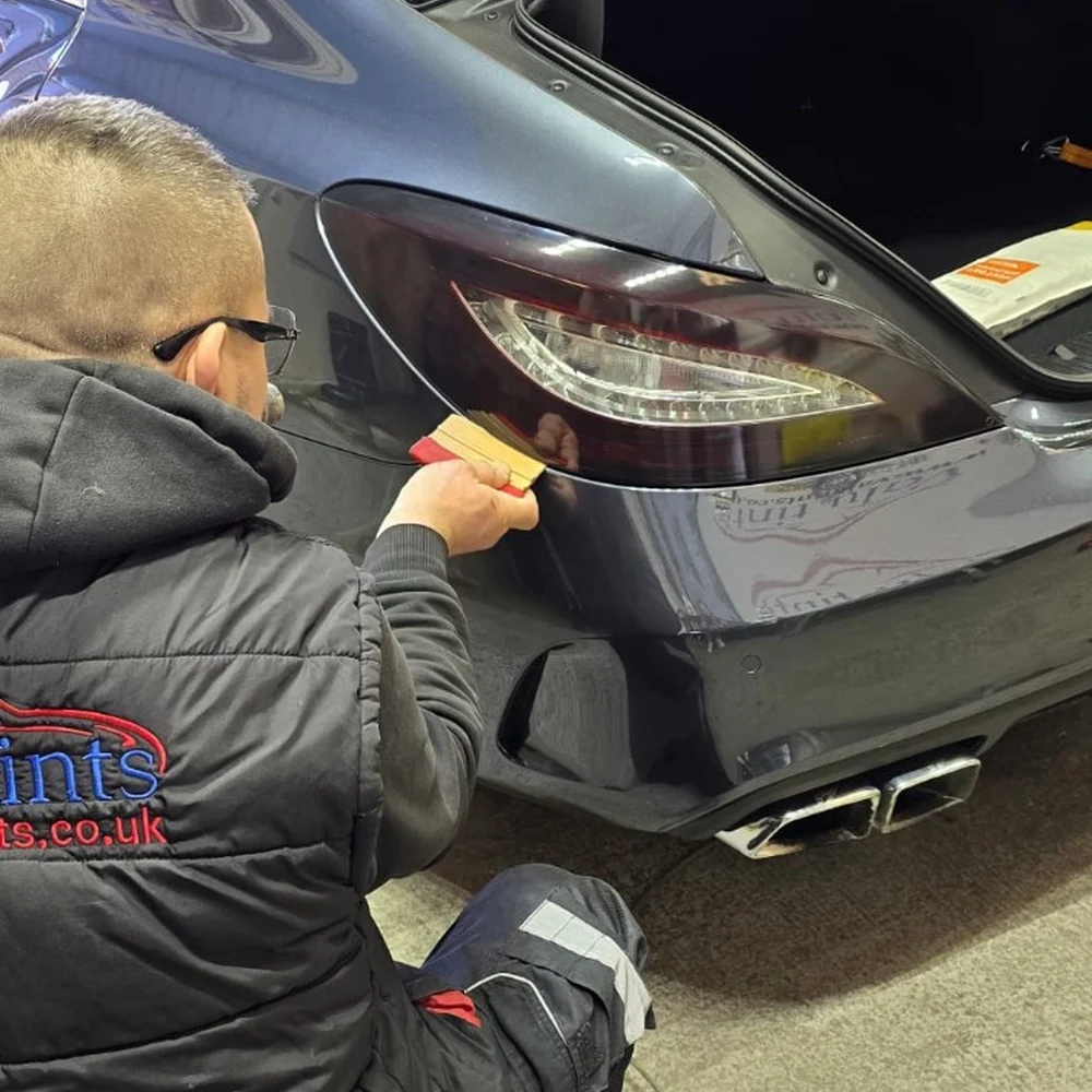 Valu Tints technician applying film to a rear light